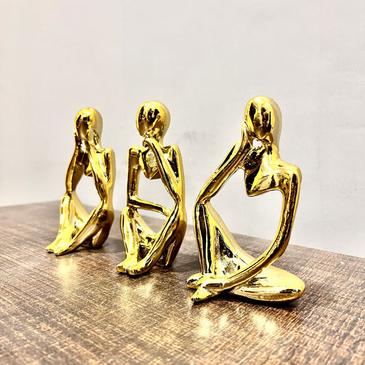 Gold-plated thinker statue